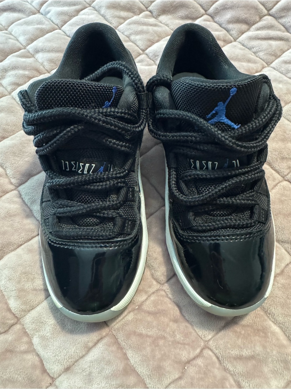 Iconic Air Jordan 11 Retro Low “Space Jam” in the preschool/little kids’ size.